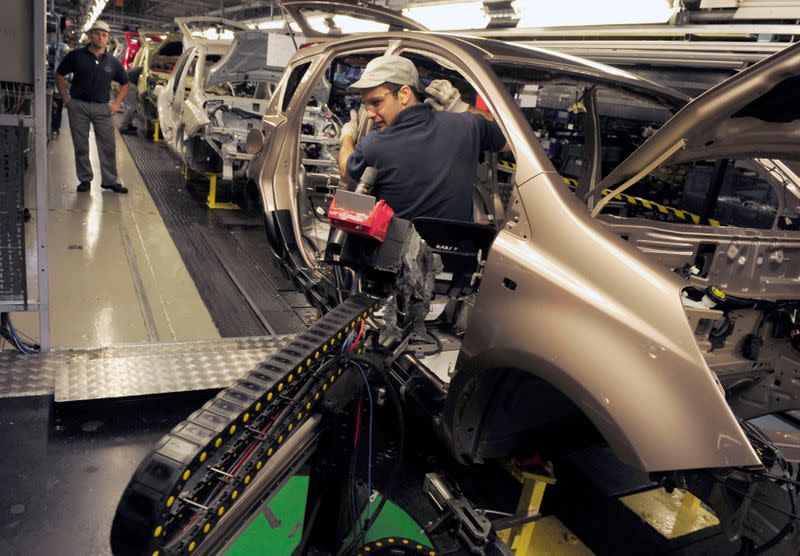 FILE PHOTO: An employee works on the production line at the Nissan car factory in Washington