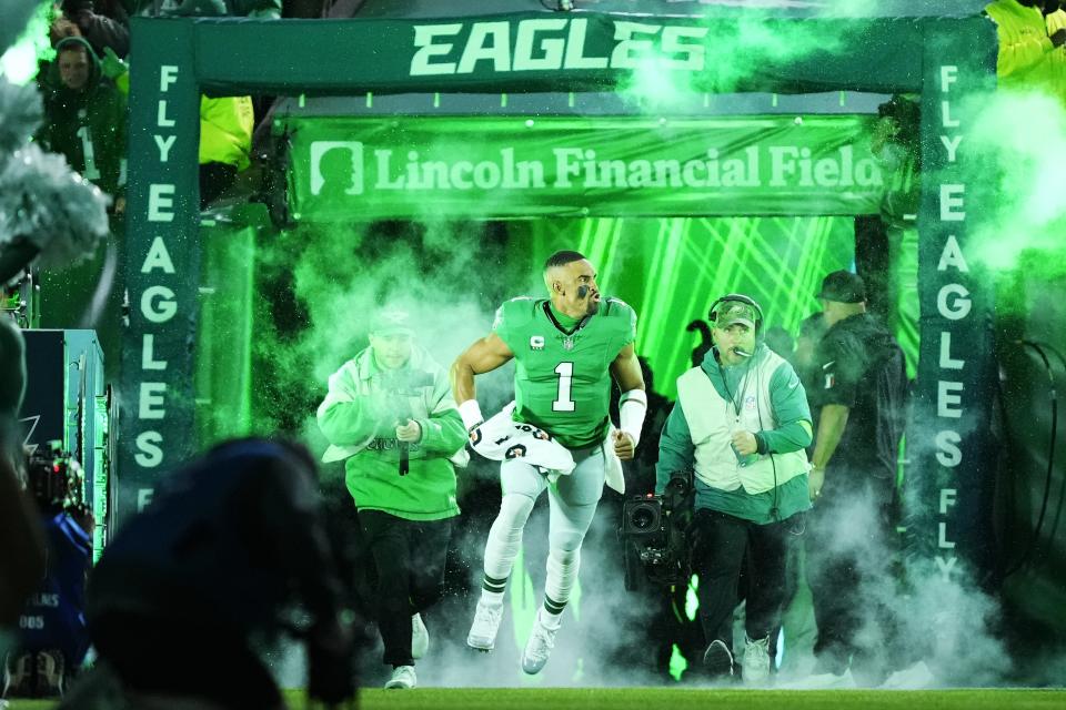 Philadelphia Eagles quarterback Jalen Hurts (1) runs out before an NFL football game against the Miami Dolphins on Sunday, Oct. 22, 2023, in Philadelphia. (AP Photo/Matt Rourke)