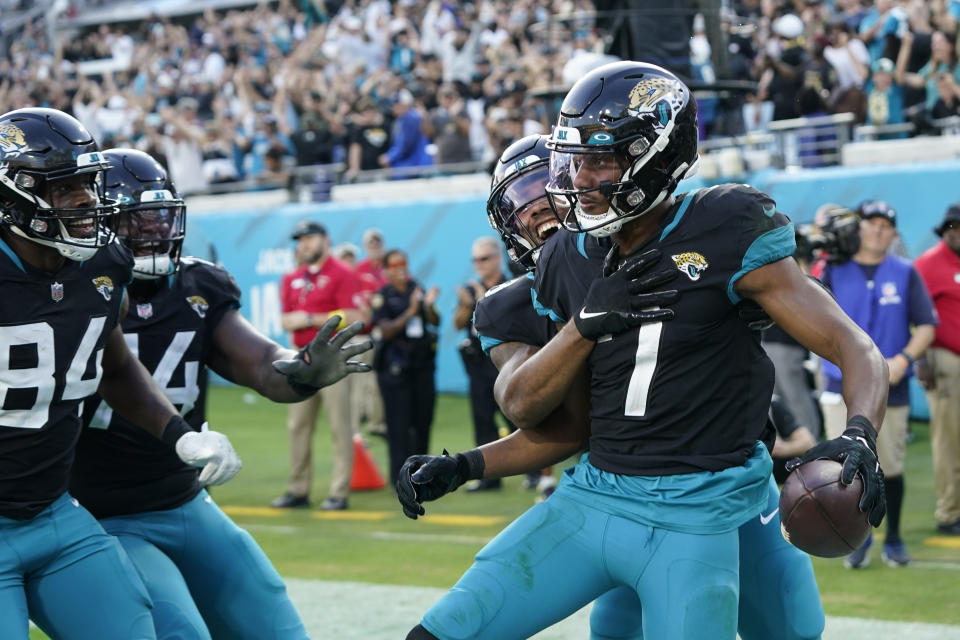 Jacksonville Jaguars wide receiver Zay Jones (7) celebrates a two-point conversion catch with his team during the second half of an NFL football game against the Baltimore Ravens, Sunday, Nov. 27, 2022, in Jacksonville, Fla. (AP Photo/John Raoux)