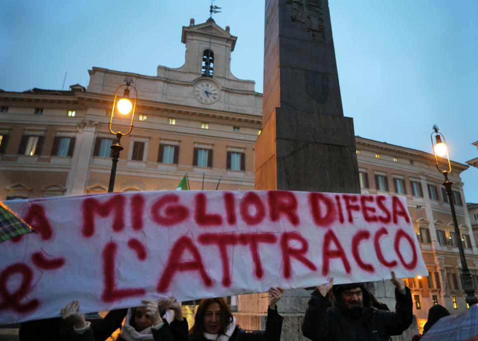 Protesters gather during a demonstration in support of German humanitarian group Sea-Watch, in front of the Italian lower chamber’s Montecitorio palace, in Rome, Monday, Jan. 28, 2019. A Sea-Watch rescue ship that picked up 47 migrants off the Libyan coasts on Jan. 19, was allowed to shelter in the Italian territorial waters due to threatening weather last Thursday, but the government refuses to let aid groups disembark the migrants in Italian ports. (AP Photo/Andrew Medichini)