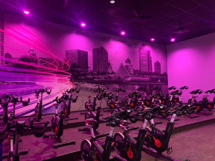 With its color-shifting lights, the cycle studio inside Vasa Fitness, 13995 W. National Ave. in New Berlin, creates a dramatic background for those who use the class-oriented equipment. Classes are offered as part of the middle-priced membership package.