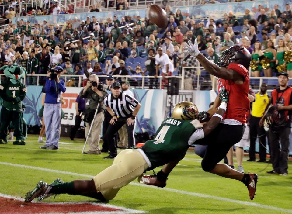 Northern Illinois wide receiver Jauan Wesley, right, can't make a catch as UAB cornerback Starling Thomas V (4) defends during the first half of the Boca Raton Bowl NCAA college football game, Tuesday, Dec. 18, 2018, in Boca Raton, Fla. (AP Photo/Lynne Sladky)