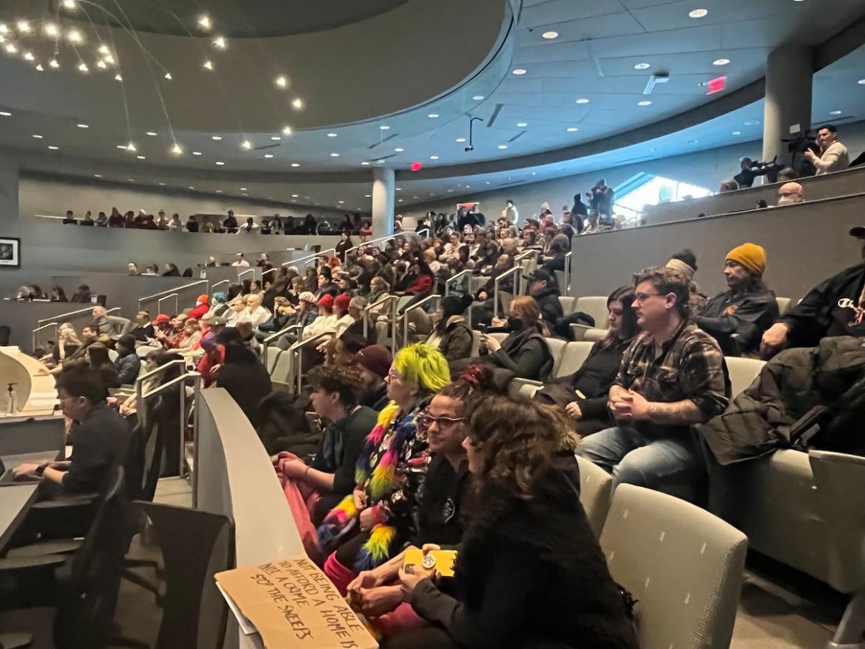 The public sat in on the meeting at Edmonton city hall Monday, as some started heckling and shouting from the back.  (Natasha Riebe/CBC - image credit)