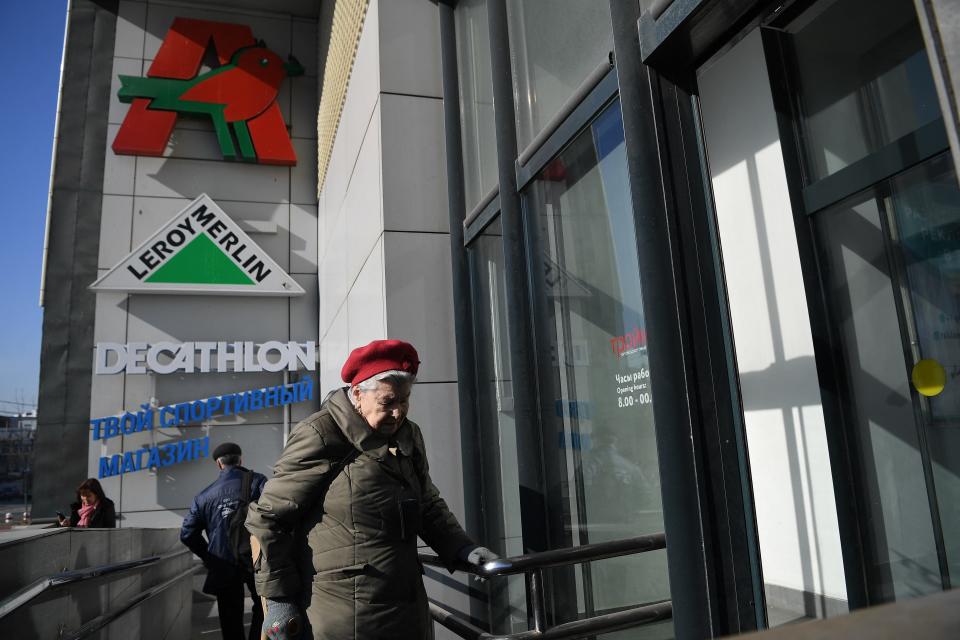 A woman enters an open store belonging to Auchan, Decathlon, and Leroy Merlin in Moscow, Russia on March 24.