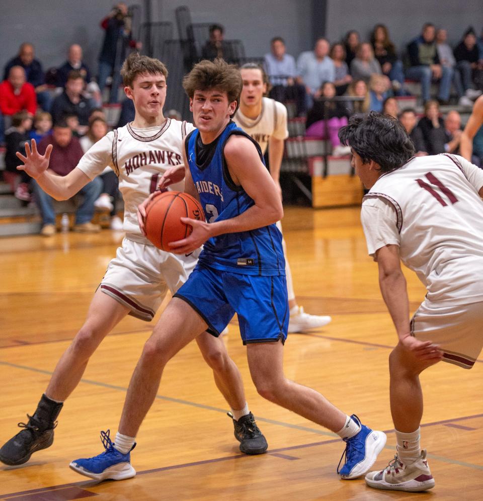 Dover-Sherborn junior Jono Windle works to get the ball to the basket during the game in Millis, Jan. 31, 2023. The Raiders defeated the Mohawks, 75-60.