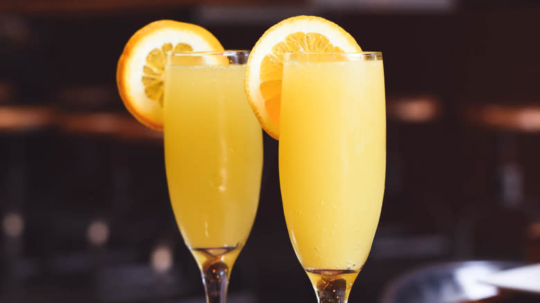 Two mimosas with orange slices