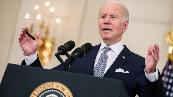 President Biden stands at a podium as he speaks at the White House.