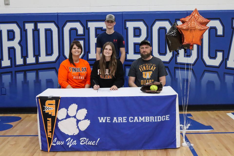 Cambridge High senior Abby Mann recently signed her Letter of Intent to attend the University of Findlay to continue both her academic and softball careers. Pictured left to right are mother Jennifer Mann, Abby Mann, father Chad Mann and brother Benson Mann