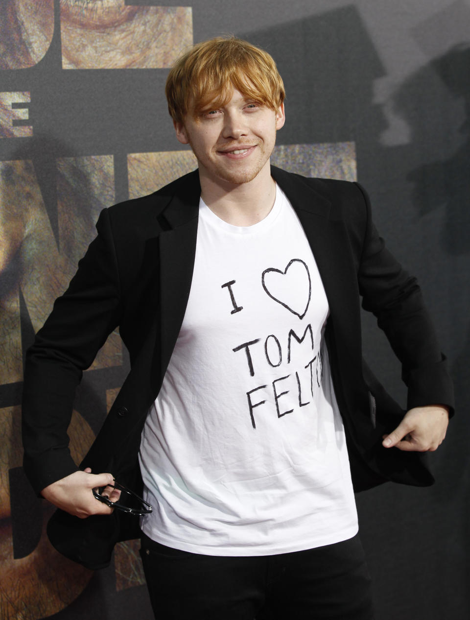 Actor Rupert Grint poses at the premiere of "Rise of the Planet of the Apes" at the Grauman's Chinese theatre in Hollywood, California July 28, 2011. The movie opens in the U.S. on August 5.   REUTERS/Mario Anzuoni (UNITED STATES - Tags: ENTERTAINMENT)