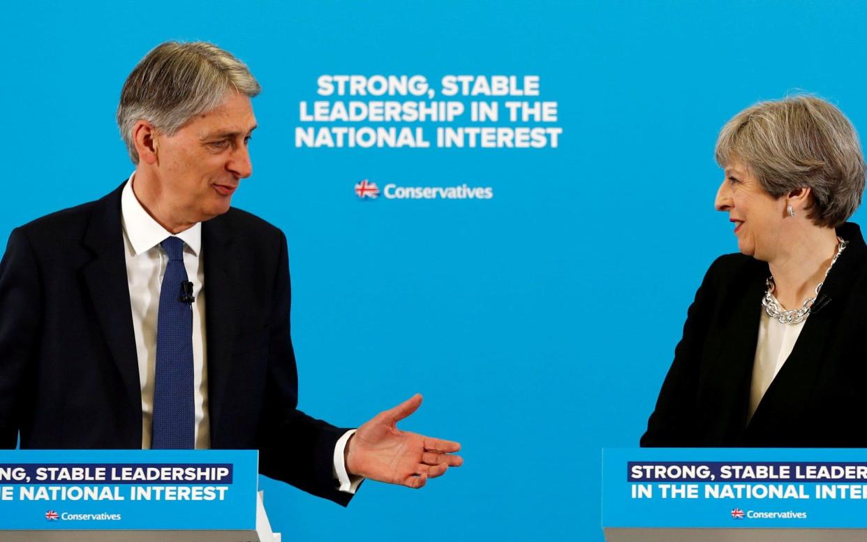 At loggerheads: Philip Hammond is fighting Theresa May for a softer Brexit - REUTERS