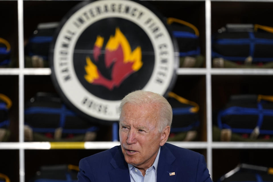 FILE - President Joe Biden speaks during a visit to the National Interagency Fire Center, Sept. 13, 2021, in Boise, Idaho. Biden on June 21, 2022, signed off on giving federal wildland firefighters a hefty raise for the next two fiscal years, a move that comes as much of the West is bracing for a difficult wildfire season. (AP Photo/Evan Vucci, File)