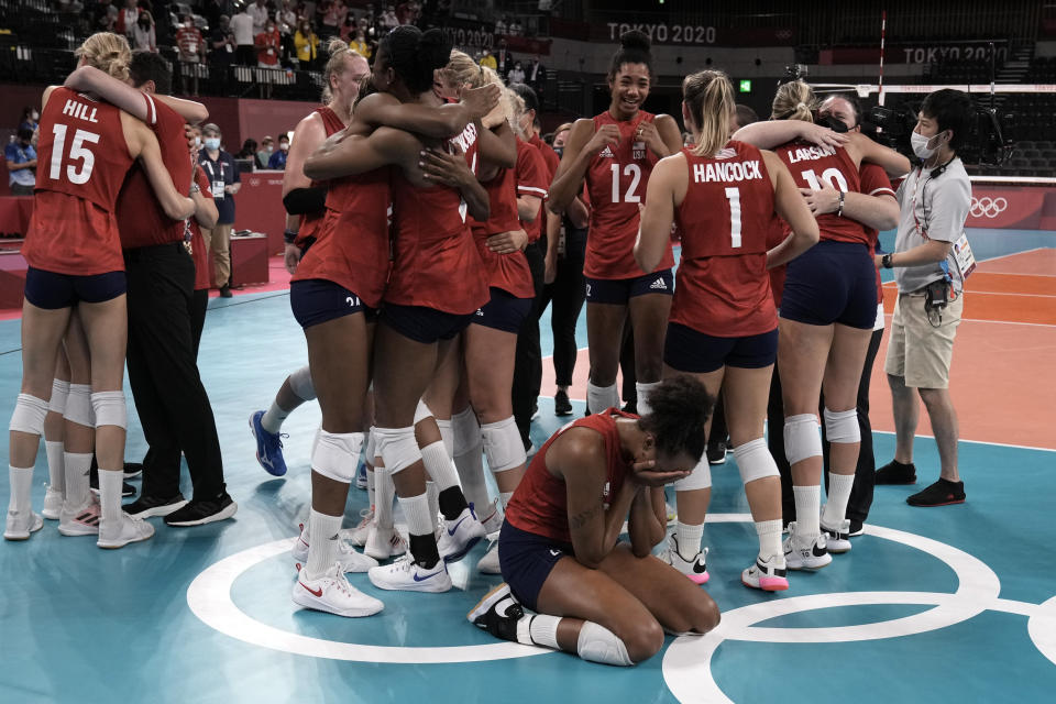 Players from the United States react after defeating Brazil to win the gold medal in women's volleyball at the 2020 Summer Olympics, Sunday, Aug. 8, 2021, in Tokyo, Japan. (AP Photo/Manu Fernandez)