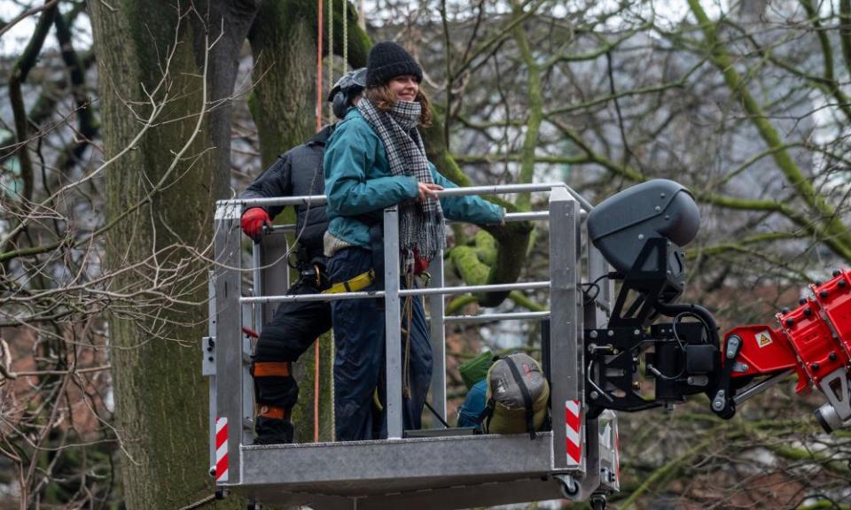 An HS2 protester in Euston Square Gardens is evicted during a police operation to remove them.