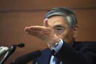 Bank of Japan Gov. Haruhiko Kuroda gestures as he take a question from a journalist during a news conference in Tokyo Monday, March 16, 2020. Japan's central bank took emergency action Monday to help support the economy following the U.S. Federal Reserve's decision to cut its benchmark interest rate to nearly 0%. (AP Photo/Eugene Hoshiko)