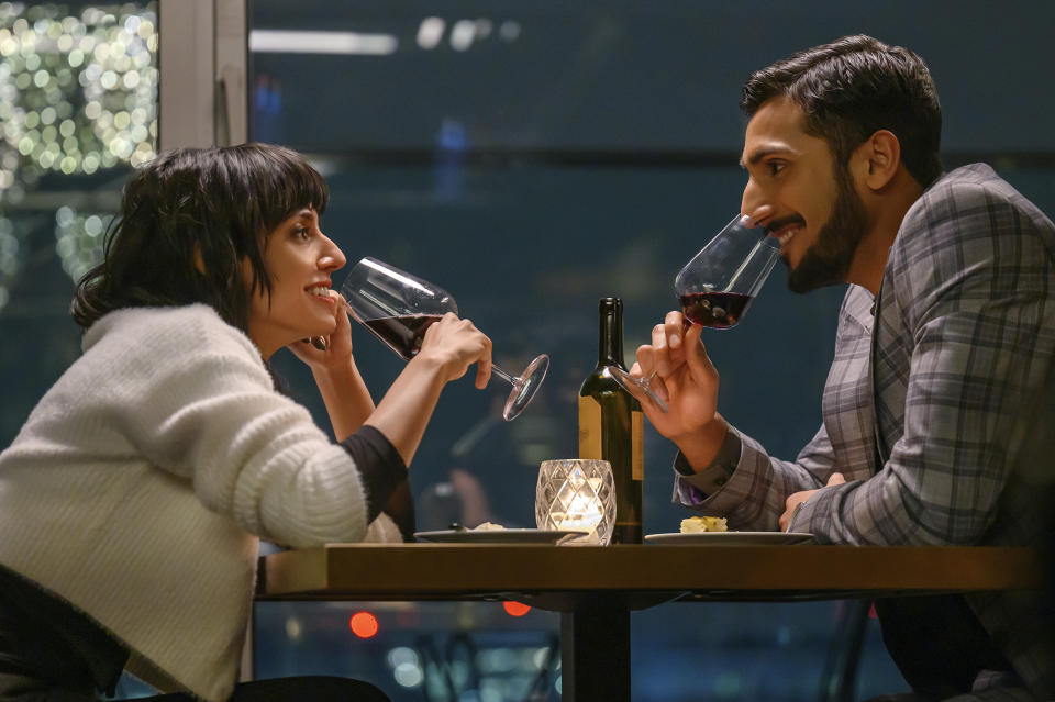 This image released by Focus Features shows Ritu Arya, left, and Akshay Khanna in a scene from "Polite Society." (Parisa Taghizadeh/Focus Features via AP)