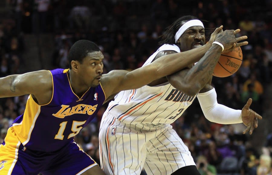 Wallace battling for the ball against another player known for his physical style of play, Ron Artest. (Photo by Streeter Lecka/Getty Images)