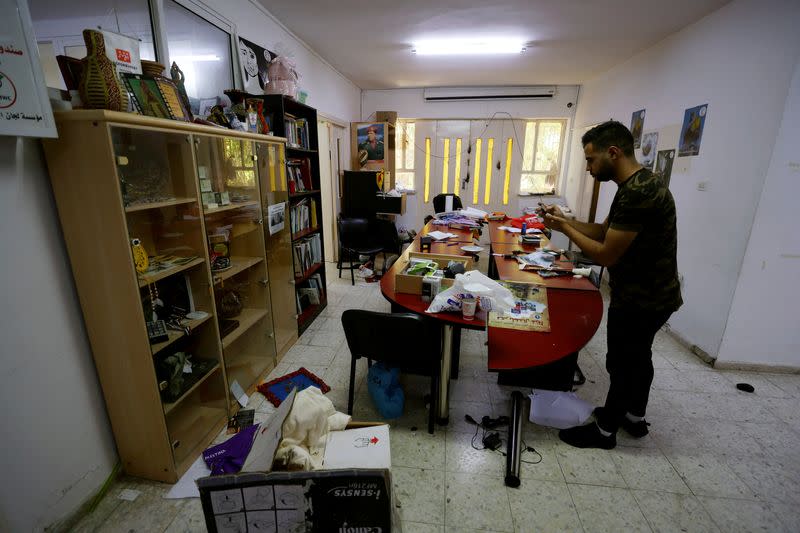 A Palestinian man stands inside of the Union of Palestinian Women's Committees, in Ramallah in the Israeli-Occupied West Bank