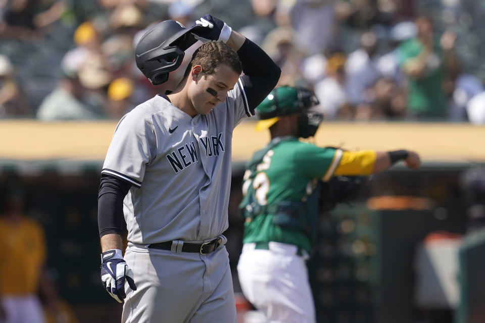 New York Yankees' Anthony Rizzo reacts after striking out against the Oakland Athletics during the sixth inning of a baseball game in Oakland, Calif., Saturday, Aug. 28, 2021. (AP Photo/Jeff Chiu)