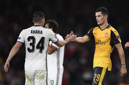 Britain Soccer Football - Arsenal v FC Basel - UEFA Champions League Group Stage - Group A - Emirates Stadium, London, England - 28/9/16 FC Basel's Taulant Xhaka with his Brother Granit Xhaka of Arsenal after the match Reuters / Dylan Martinez Livepic EDITORIAL USE ONLY.