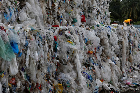 Plastic waste are piled outside an illegal recycling factory in Jenjarom, Kuala Langat, Malaysia October 14, 2018. Picture taken October 14, 2018. REUTERS/Lai Seng Sin