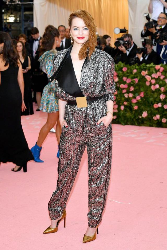 Emma Stone Arrives in the Shiniest Louis Vuitton Jumpsuit to the