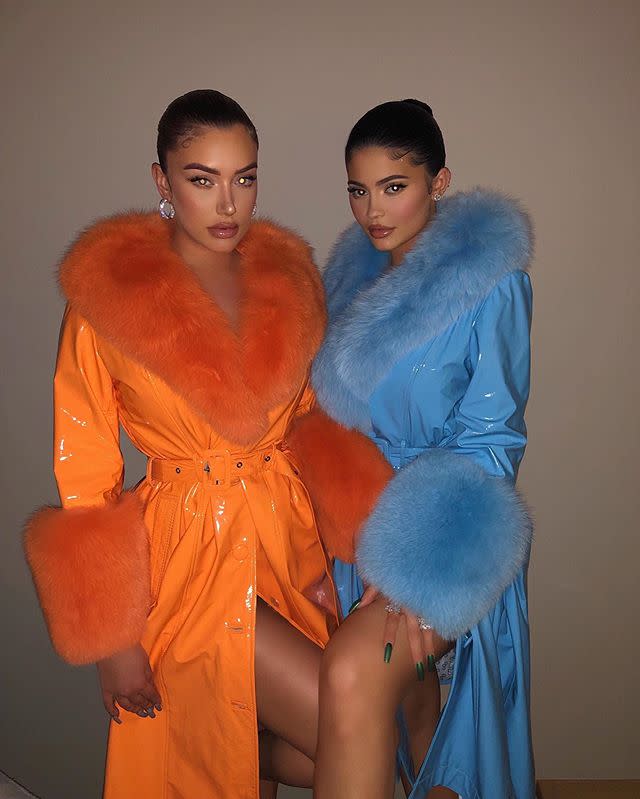 <p>Always loving a neon moment, Stassie and Kylie wore matching patent leather trench coats with dramatic fur accents, with Stassie in a vibrant tangerine hue and Kylie in a sky blue. </p>