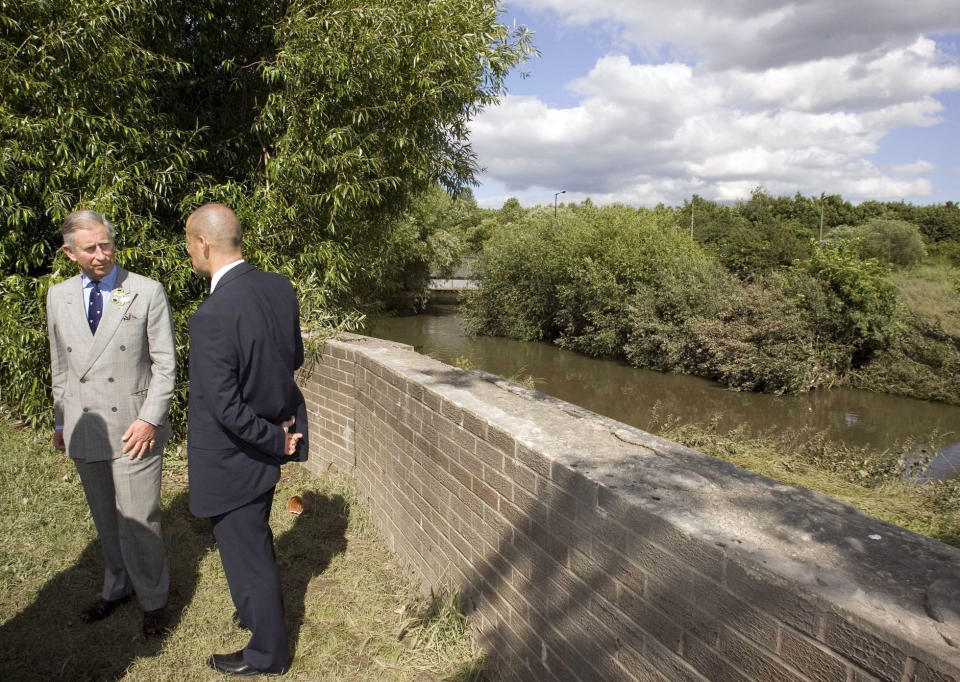 Prince Charles, Prince of Wales views the river that broke its banks when he visits the village of Carcliffe in South Yorkshire to meet emergency service personnel and residents affected by the recent floods brought on by heavy rains.