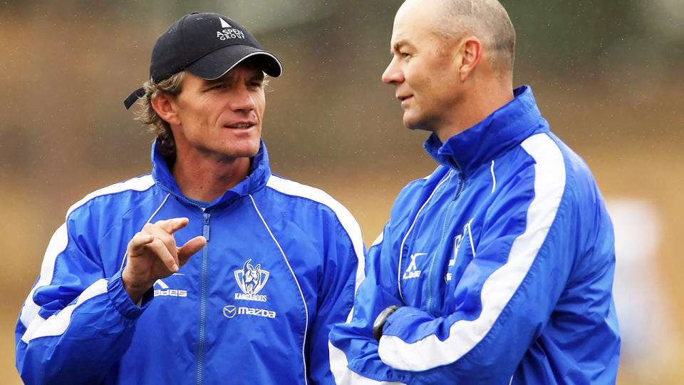 Dean Laidley speaks with his assistant Darren Crocker in 2009.  (Photo by Mark Dadswell/Getty Images)