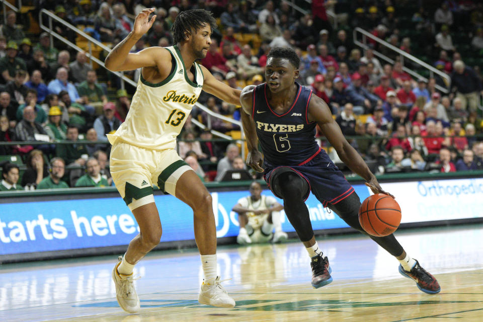 Dayton guard Enoch Cheeks (6) drives to the basket against George Mason guard Darius Maddox (13) during the first half of an NCAA college basketball game, Wednesday, Feb. 21, 2024, in Fairfax, Va. (AP Photo/Jess Rapfogel)