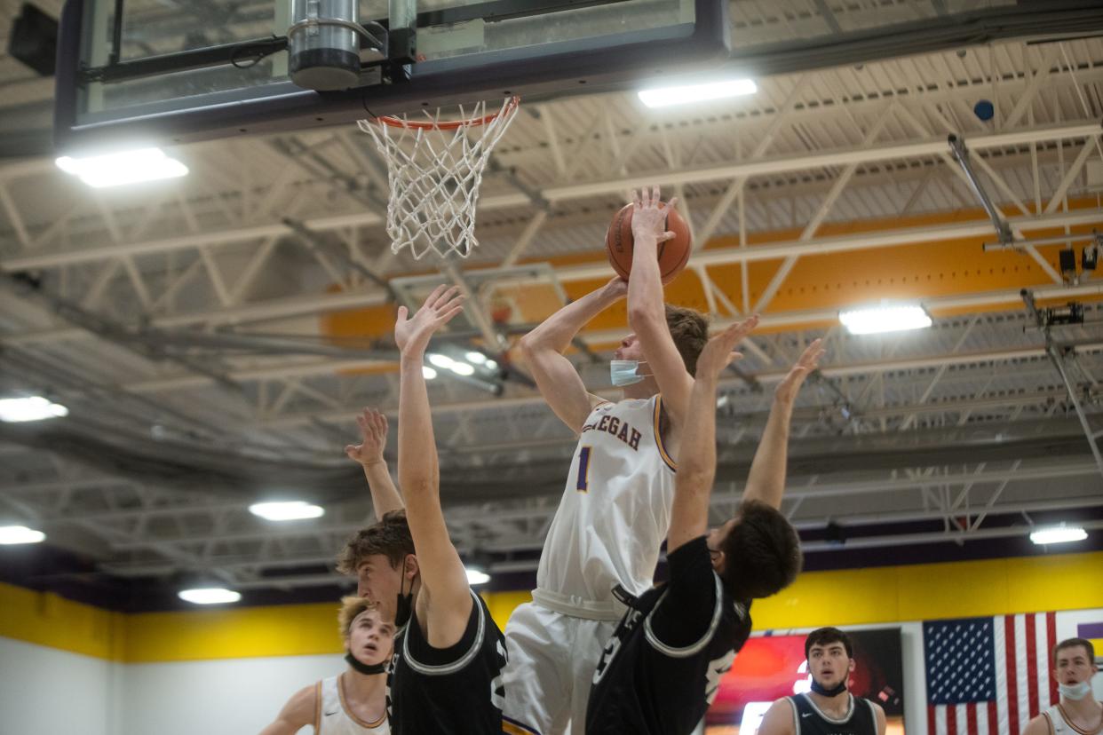 Hononegah's 6-foot-5 junior forward Chase Kemmet shoots against Normal West on Saturday, January 15, 2022, at Hononegah High School. Normal West won the MLK tourney game 65-55.