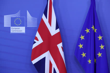 FILE PHOTO: The Union Jack and the European Union flags hang at the European Commission headquarters in Brussels, Belgium February 7, 2019. REUTERS/Yves Herman/File Photo