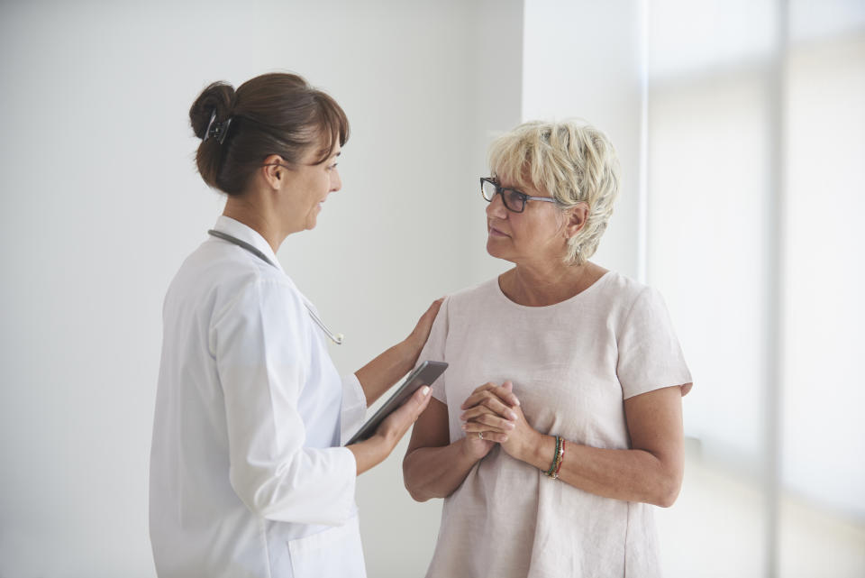 Woman speaking to doctor about breast cancer. (Getty Images)