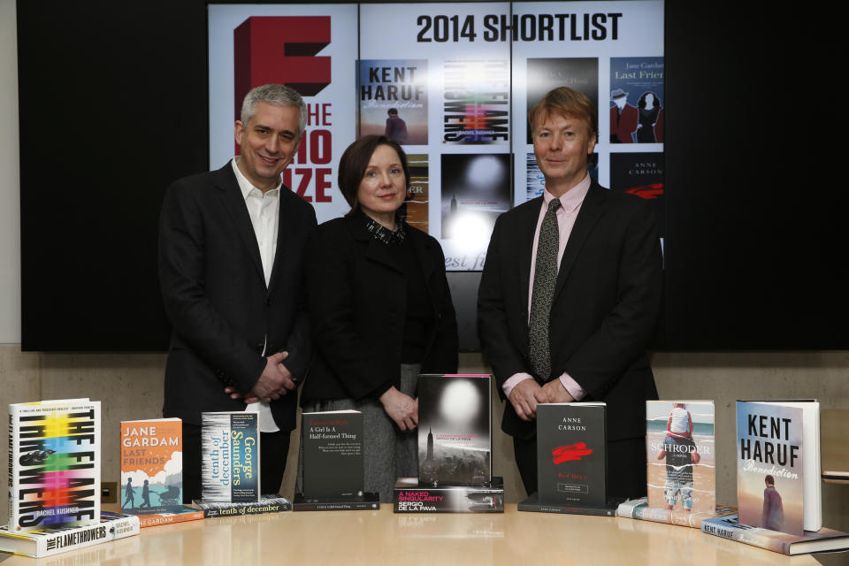 British poet Lavinia Greenlaw, center, who is chairing the judging panel of the Folio book prize, accompanied by Andrew Kidd, left, founder of the Folio Prize and Toby Hartwell, right, Managing Director of the Folio Society, pose for the photographers during a photo call following a news conference, in central London, Monday, Feb. 10, 2014. The 40,000 British pound (some 66,000 US dollars) Folio Prize is open to any work of fiction published in UK in 2013. The eight finalists of the literary prize announced Monday, include five books by U.S. writers: "Schroder" by Amity Gaige; "Benediction" by Kent Haruf; "The Flamethrowers" by Rachel Kushner; "A Naked Singularity" by Sergio De La Pava; and "Tenth of December" by George Saunders. There is also Canadian Anne Carson's "Red Doc" and two books by Britain-based writers — Jane Gardam's "Last Friends," and Eimear McBride's "A Girl is a Half-Formed thing". The winner will be announced March 10, 2014 in London.(AP Photo/Lefteris Pitarakis)