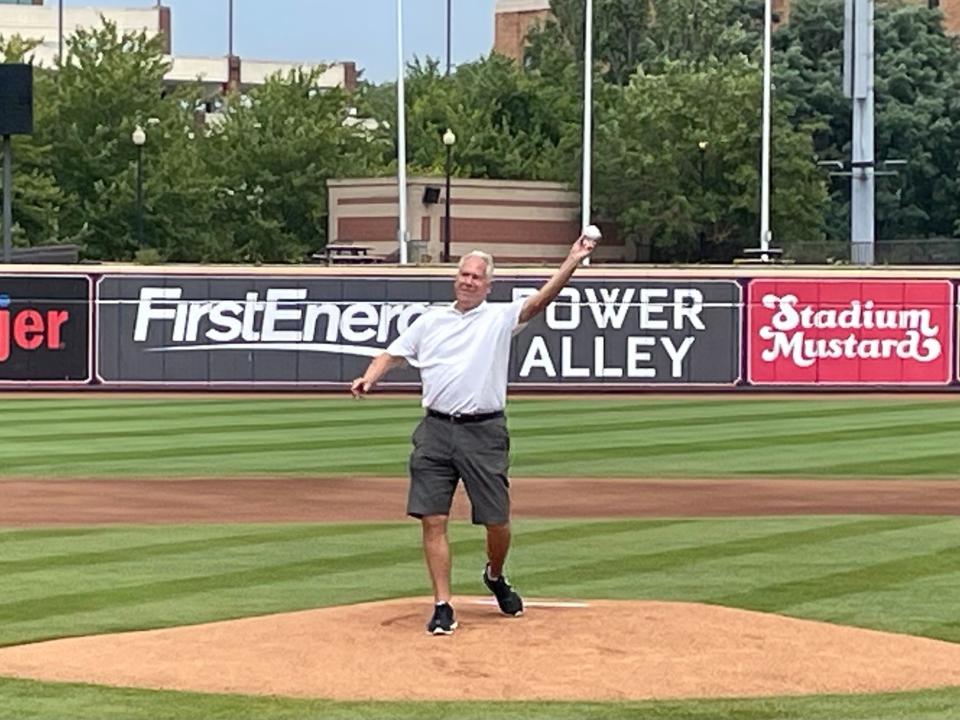 Mike Meneer throws out a ceremonial first pitch Sunday before the Akron RubberDucks' game at Canal Park. Meneer and 10 others will be inducted into the Akron Public Schools Athletics Hall of Fame in October.