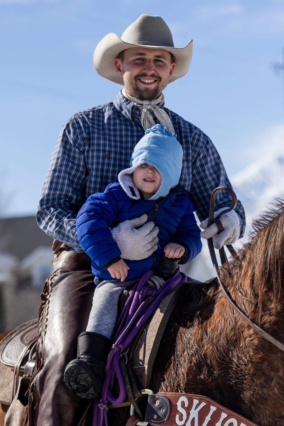 Preston Arnoldsen and his son Porter pose for a portrait during the 2024 Utah Skijoring competition at the Wasatch County Event Complex in Heber City on Saturday, Feb. 17, 2024. Arnoldsen is a past skijoring champion where he won $5,000. “It’s not about the money, it’s about the family,” he says. | Marielle Scott, Deseret News