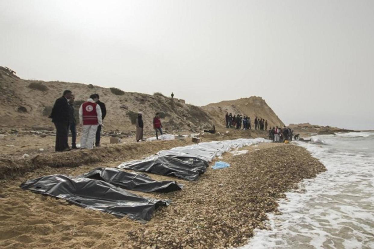 The bodies line the beach after they washed up on the Libyan coastline