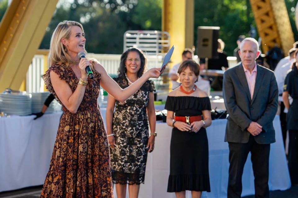 First Partner Jennifer Siebel Newsom speaks to the attendees at the Tower Bridge Dinner on the Tower Bridge between Sacramento and West Sacramento on Sunday.