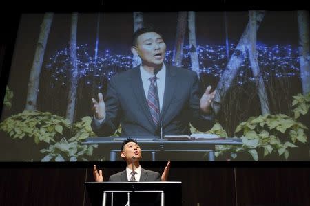 Rev. Jason Noh delivers a sermon titled "Taking Courage Through Trials" for Canadian pastor Hyeon Soo Lim who is being held in North Korea during a joint multi-cultural prayer meeting at Light Korean Presbyterian Church in Toronto, December 20, 2015. REUTERS/Hyungwon Kang