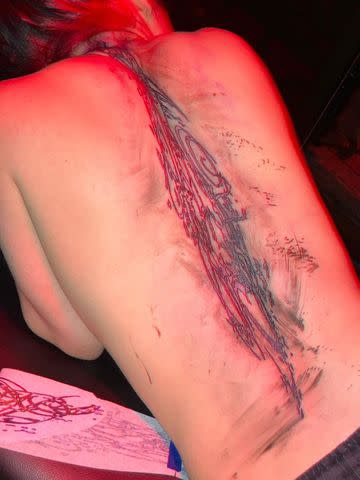 <p>Billie Eilish/Instagram</p> Billie Eilish's incomplete back tattoo pictured in a photo she posted on Instagram.