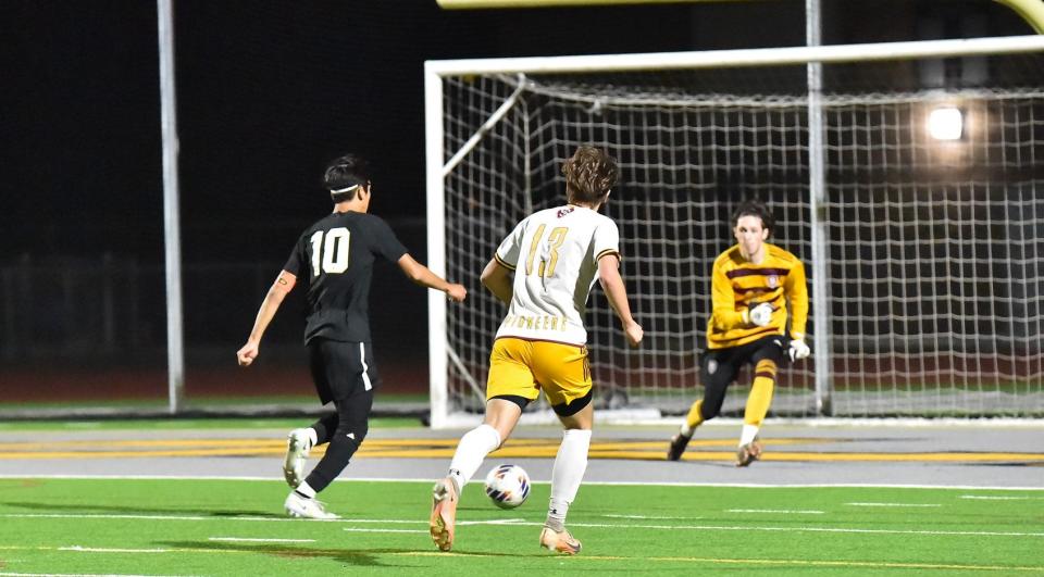 Oak Park's Charles Chowana gets ready to score one of his two goals during the Eagles' 6-1 win over Simi Valley in a Coastal Canyon League match on Friday, Jan. 19, 2024.