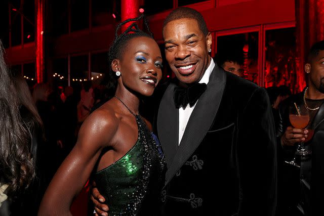 <p>Kevin Mazur/VF24/WireImage for Vanity Fair</p> Lupita Nyong'o and Busta Rhymes