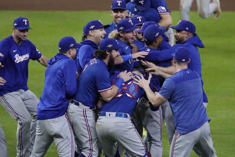 Texas Rangers players celebrate after defeating the Houston Astros in Game 7 of the ALCS on Monday at Minute Maid Park in Houston. Photo by Kevin M. Cox/UPI