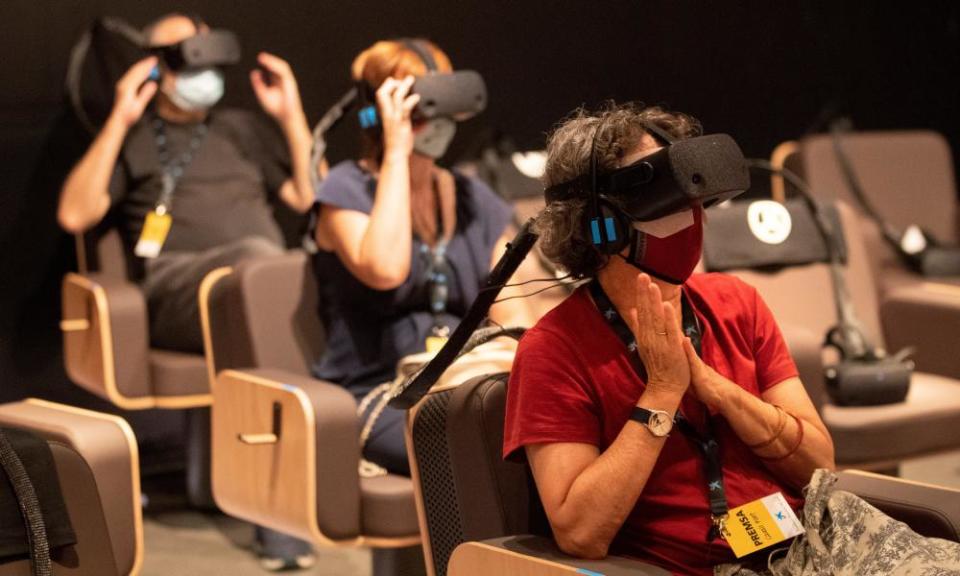 People experience the virtual reality of Symphony.