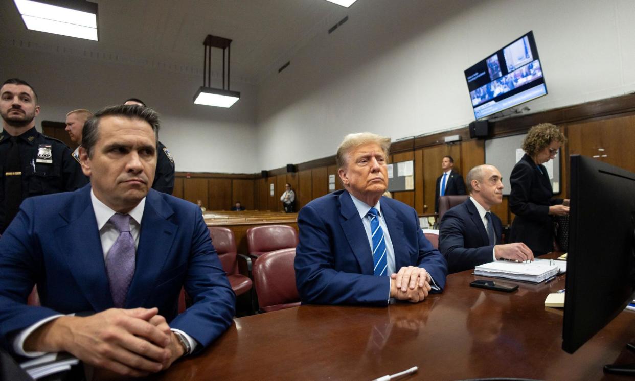 <span>Trump sits in court on Tuesday.</span><span>Photograph: Justin Lane/UPI/REX/Shutterstock</span>