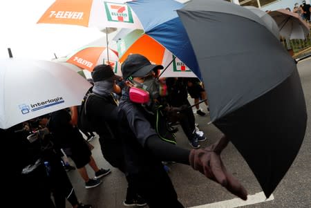 Demonstrators attend a protest in Hong Kong