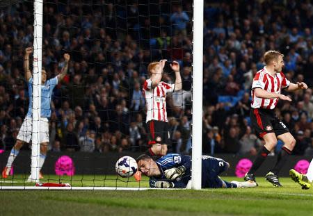 Sunderland's goalkeeper Vito Manone drops the ball as Manchester City score an equaliser during their English Premier League soccer match at the Etihad stadium in Manchester, northern England April 16, 2014. REUTERS/Darren Staples