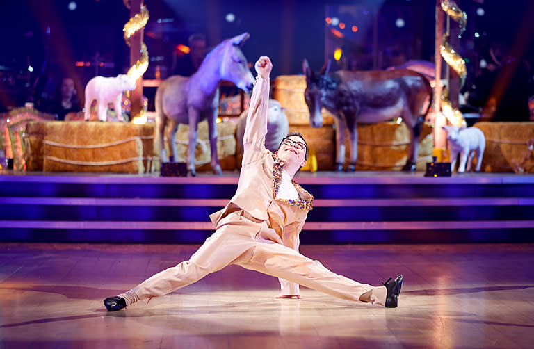 CBeebies presenter George Webster dazzled by doing the splits during his routine (Guy Levy/BBC/PA)