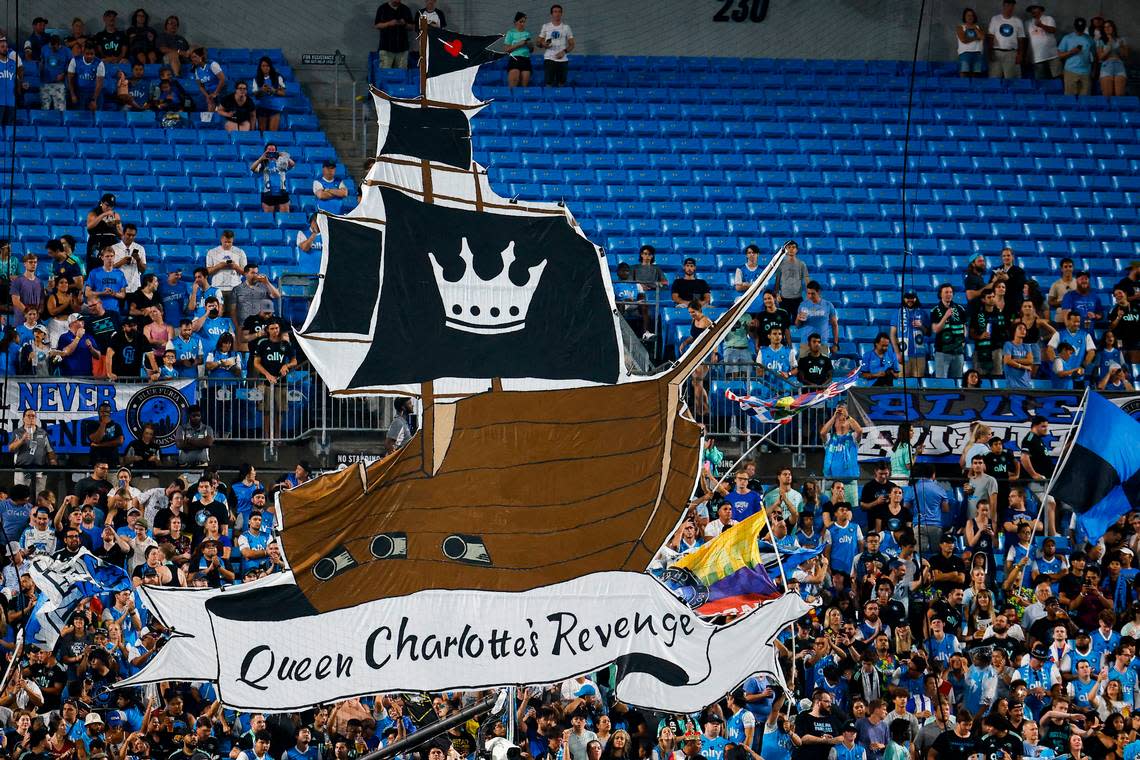 Charlotte FC fans hold a giant sign behind the home goal during a game between Charlotte FC an Columbus Crew at Bank of America Stadium in Charlotte, N.C., Saturday, July 30, 2022.