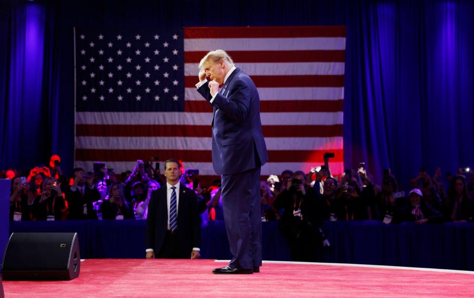 The former president dances on stage