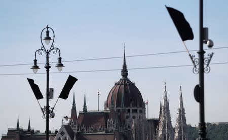 Black flags flutter on the Margaret bridge after a boat carrying South Korean tourists capsized on the Danube river in Budapest